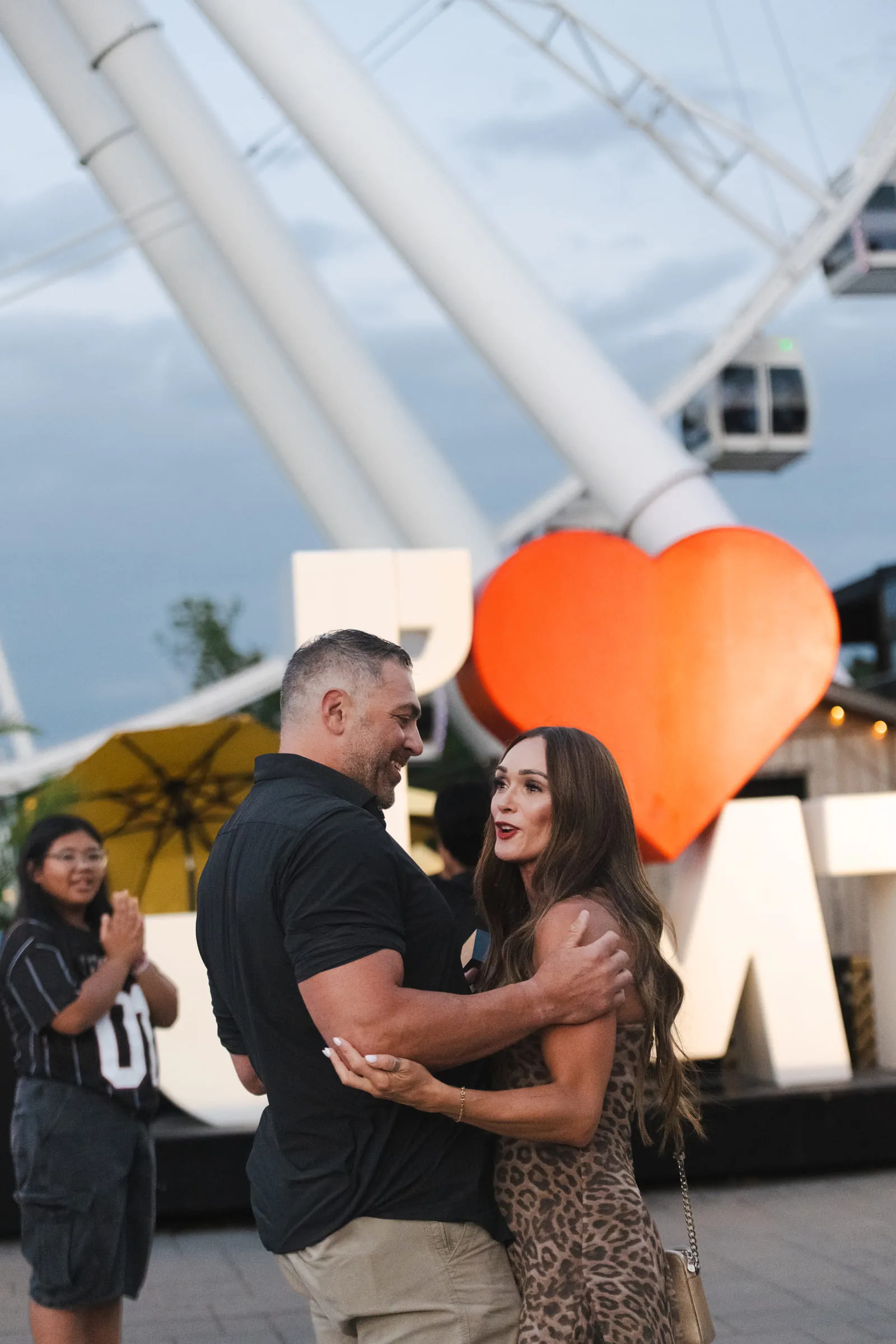 The two of them holding each other after the proposal