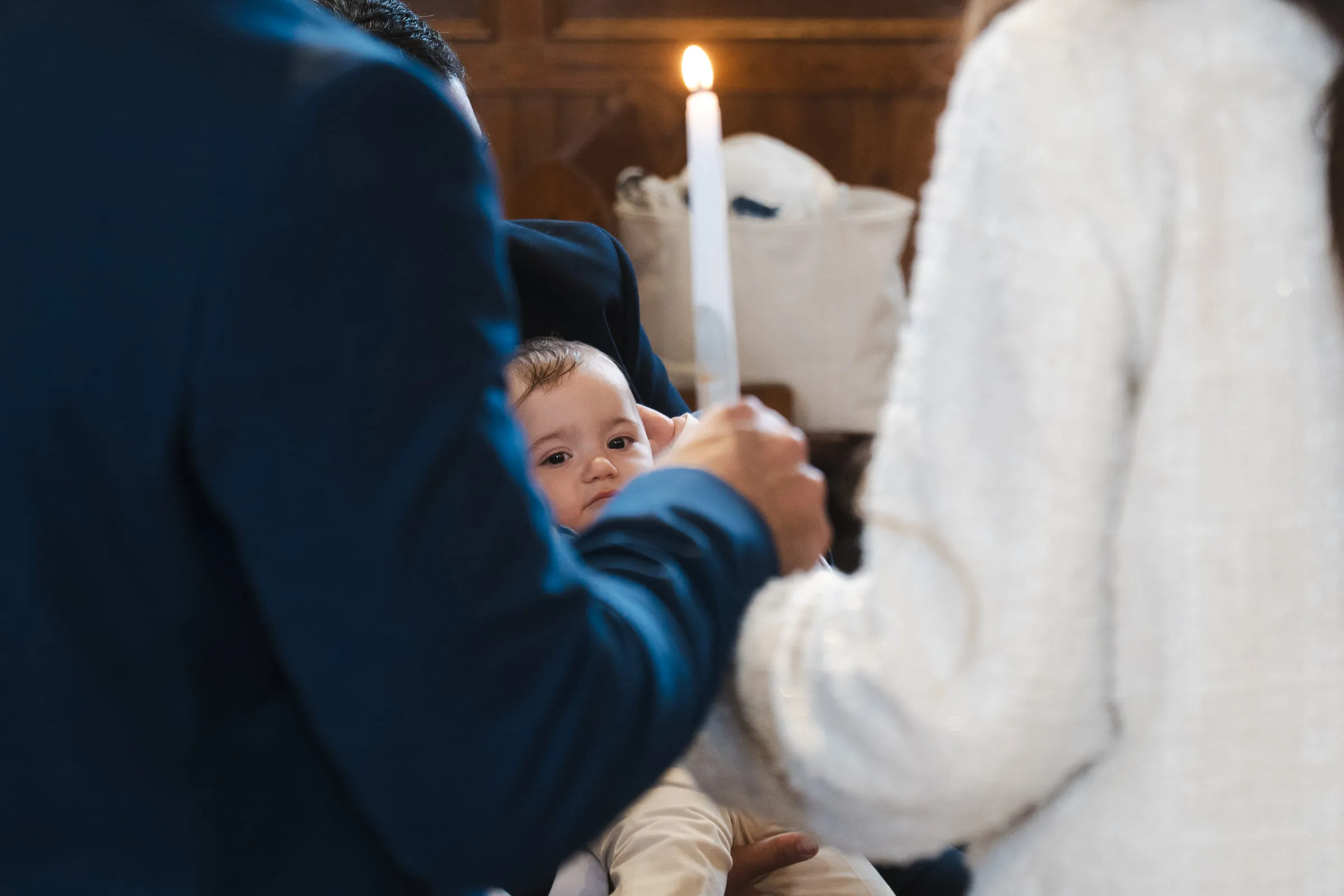 The baptismal candle held above the baby during the ceremony